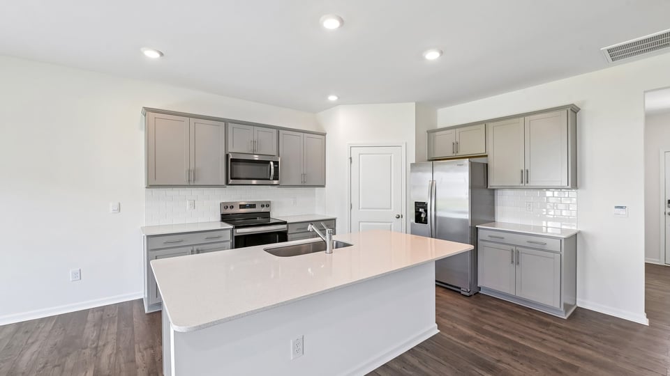 kitchen with gray cabinets island and quartz countertops