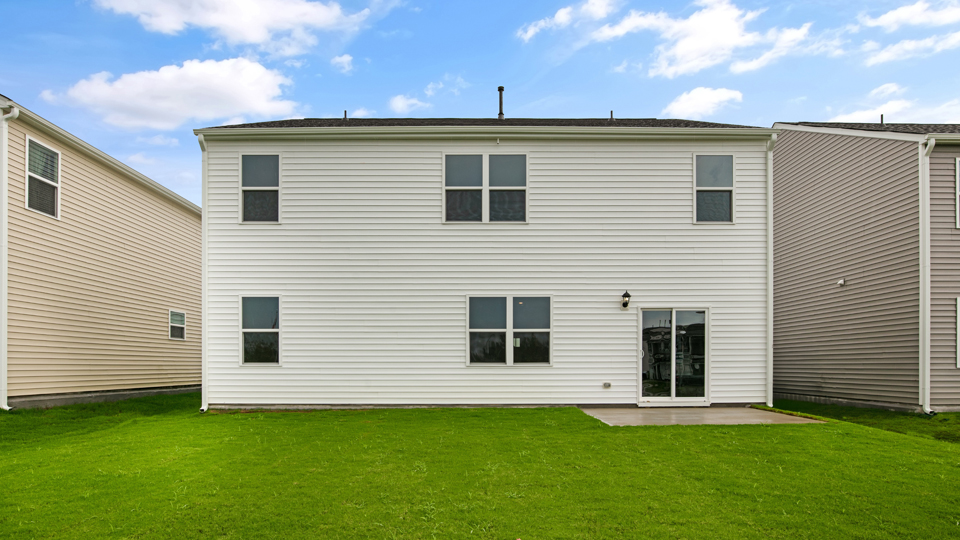 back exterior Hayden with concrete patio