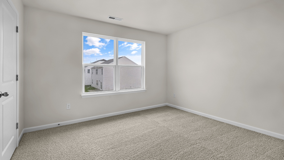 additional bedroom with window, carpeting, closet