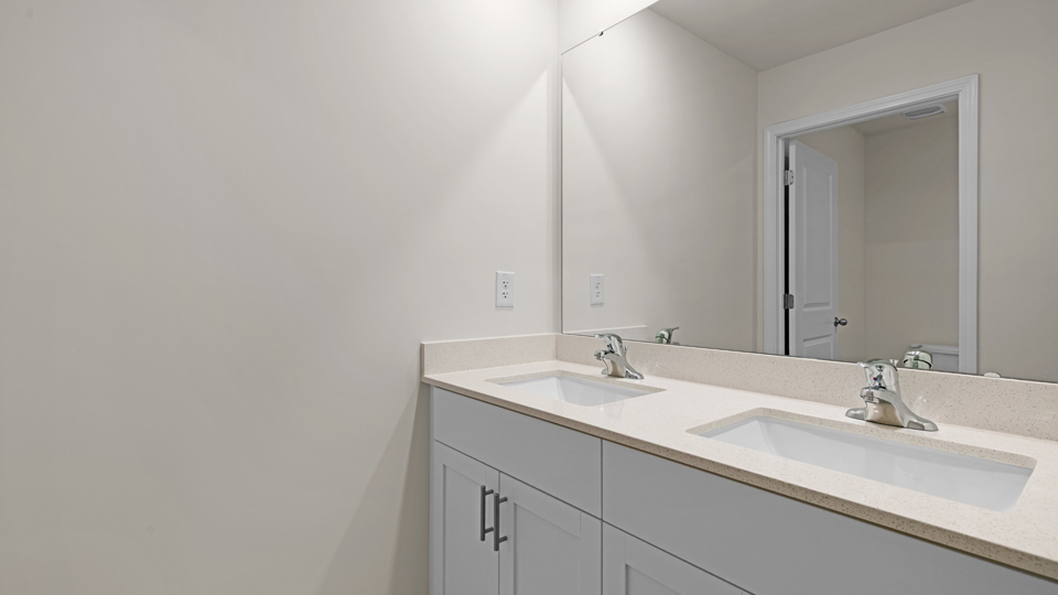 additional bathroom with double vanity sink