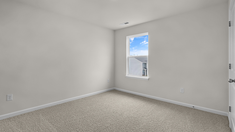 additional bedroom with window, carpeting, closet