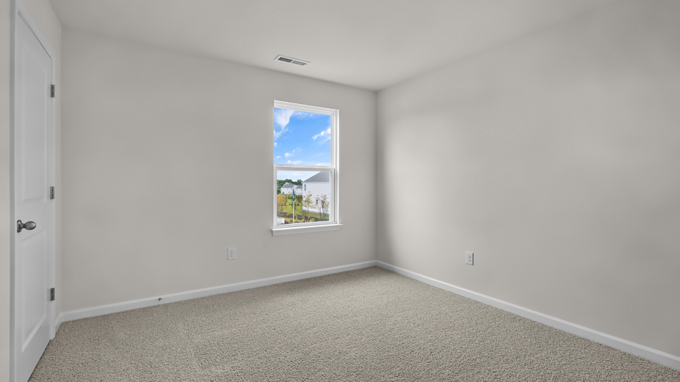 additional bedroom with window, carpeting, closet