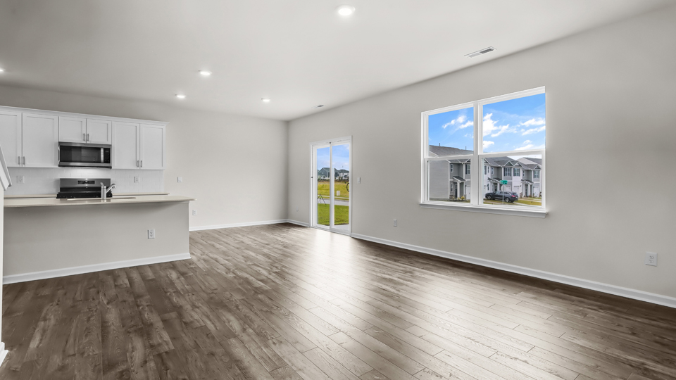 open concept living space with large windows