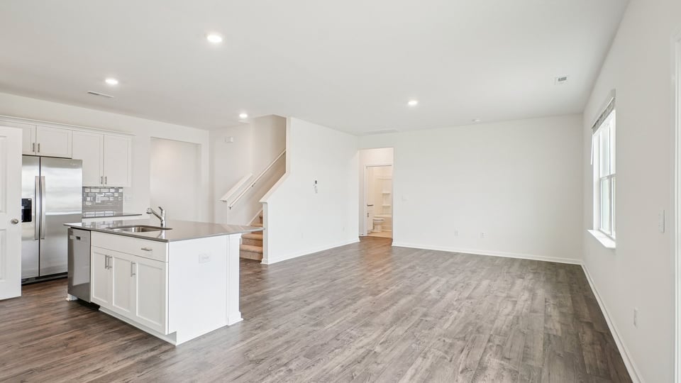 open concept living space with large windows