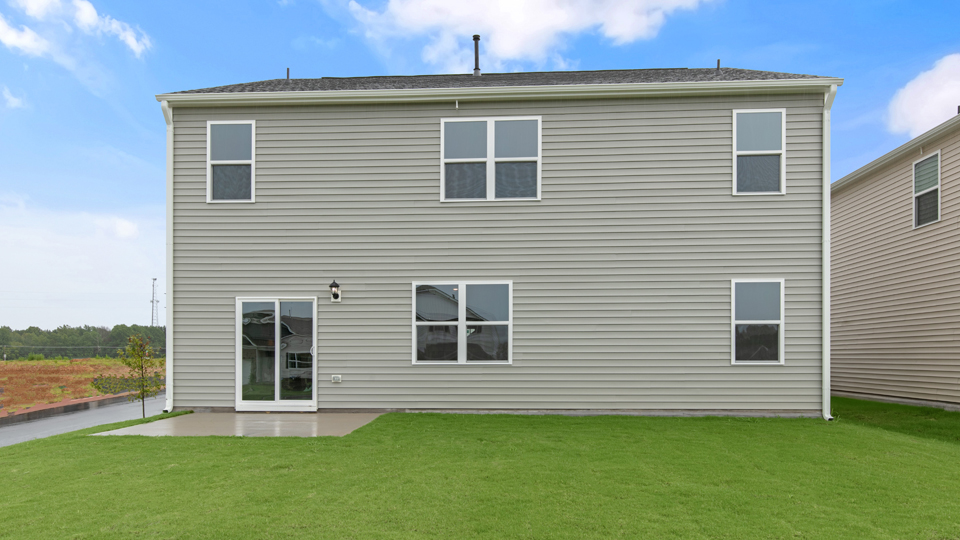 back exterior of hayden with concrete patio