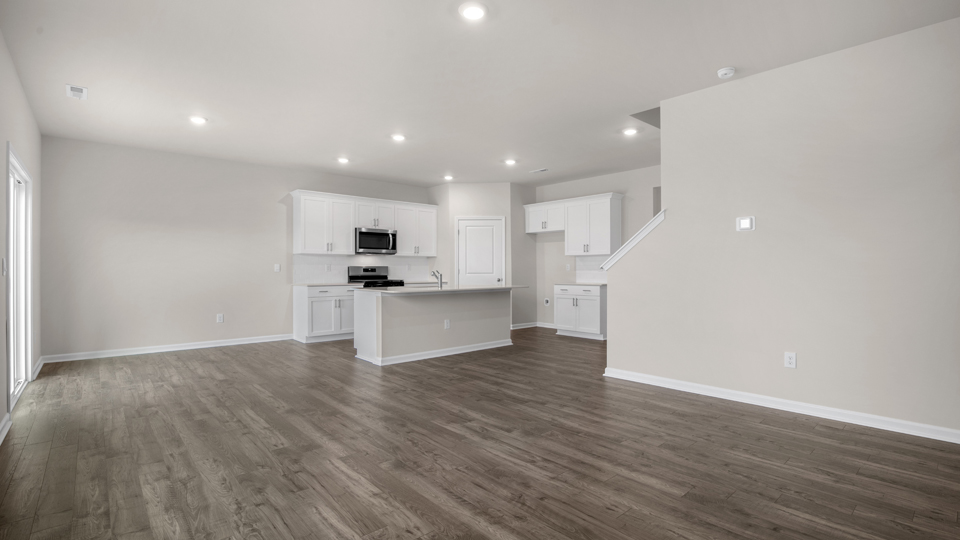 open concept living space with large windows