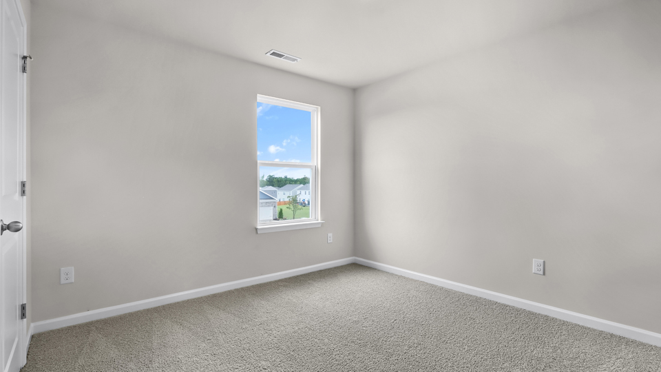 additional bedroom with window, carpeting, closet