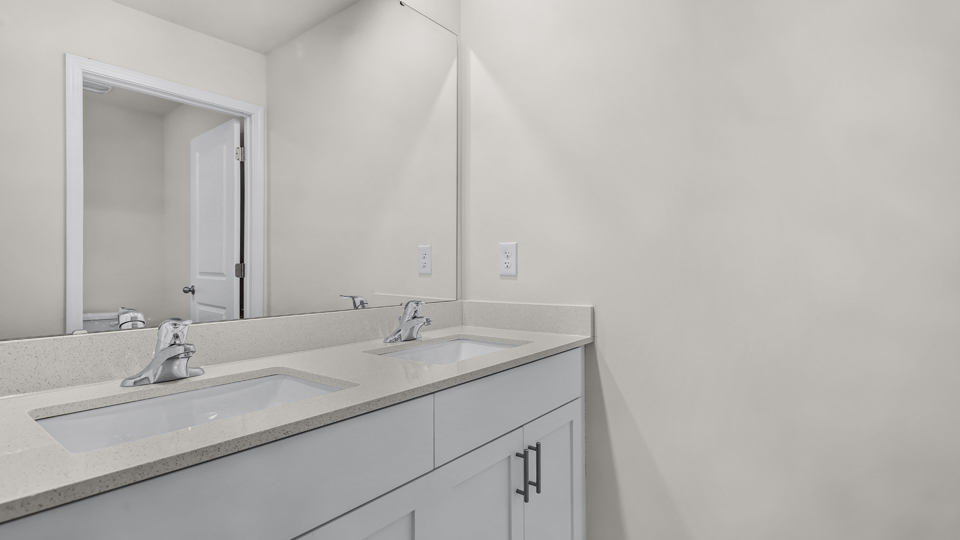 additional bathroom with double vanity sink