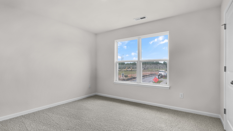additional bedroom with window, carpeting, closet