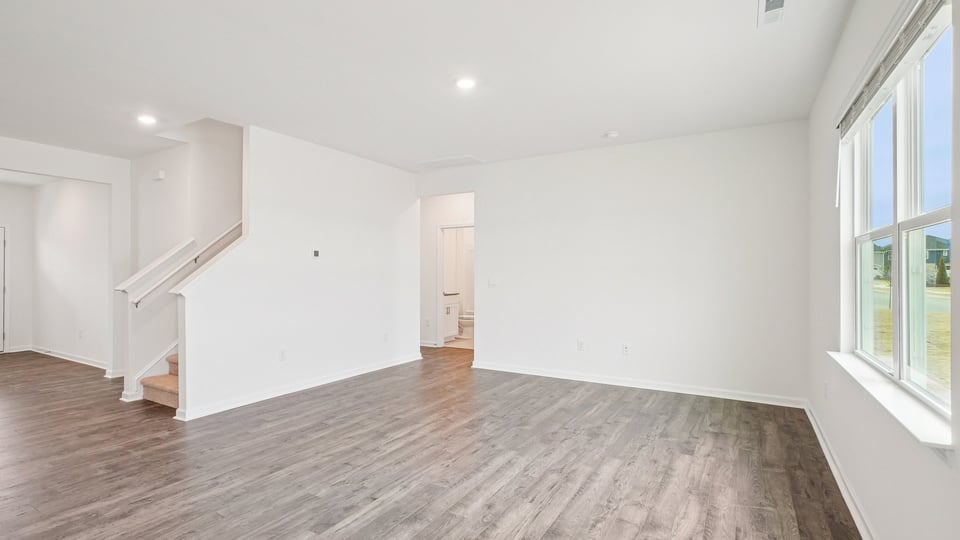 open concept living space with large windows