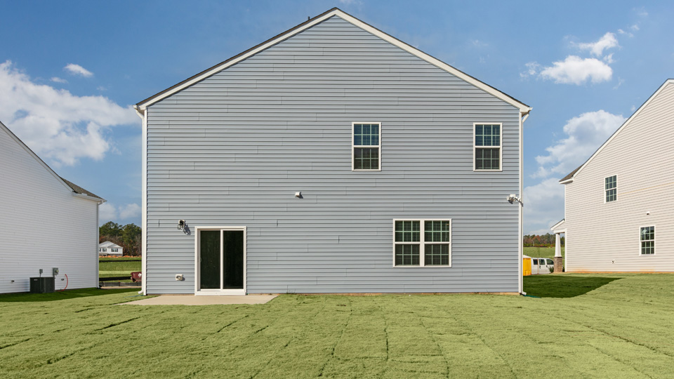 back exterior of wilmington with concrete patio