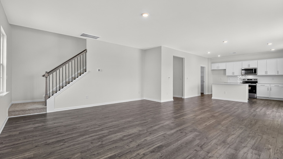 LIVING ROOM AND STAIRWELL