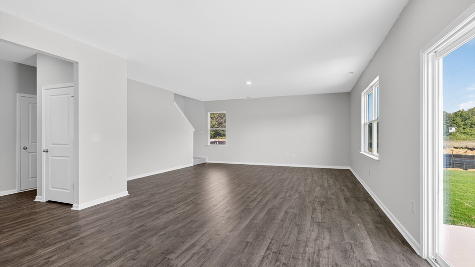 open concept living space with large windows