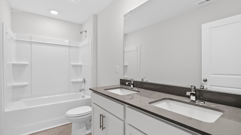 additional bathroom with double vanity sink