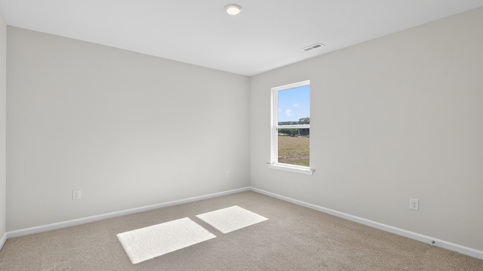 additional bedroom with window, carpeting, closet