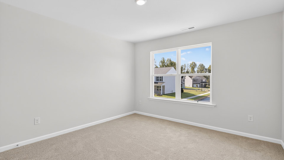 additional bedroom with window, carpeting, closet