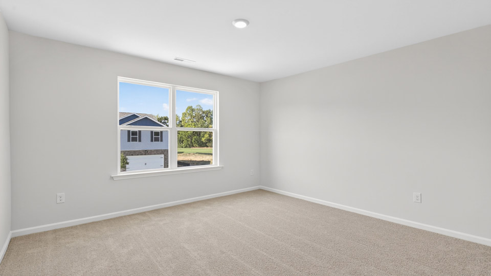 additional bedroom with window, carpeting, closet