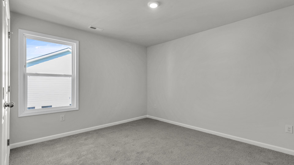 additional bedroom with window, carpeting, closet