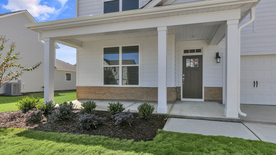 front exterior of lawson with 2 car garage