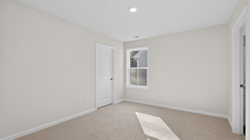 additional bedroom with window, carpeting, closet
