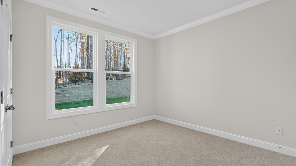 additional bedroom with window, carpeting, closet