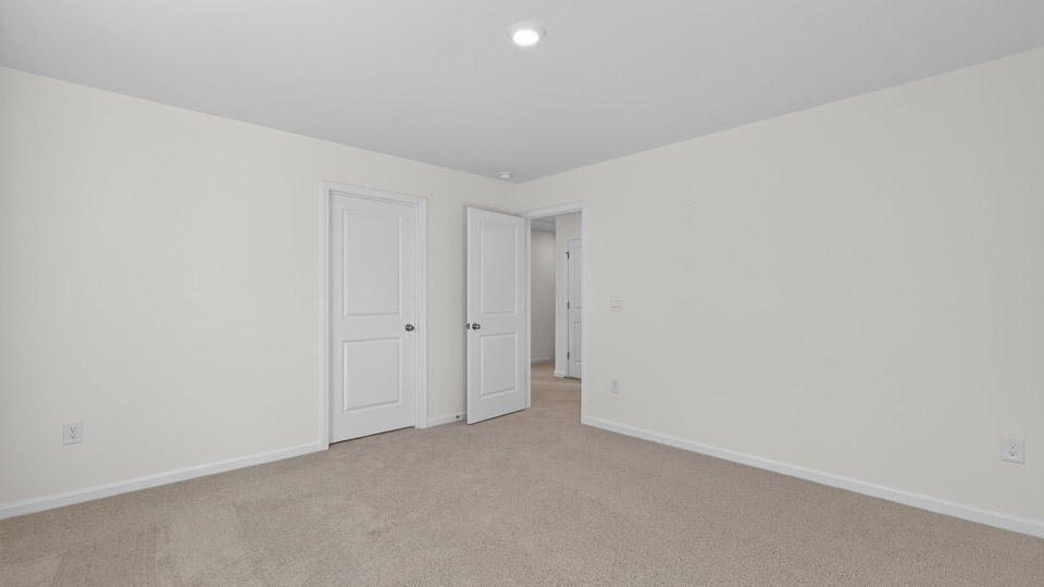 Bedroom with carpet floor and closet