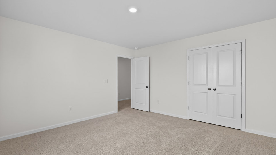 Bedroom with carpet floor and closet