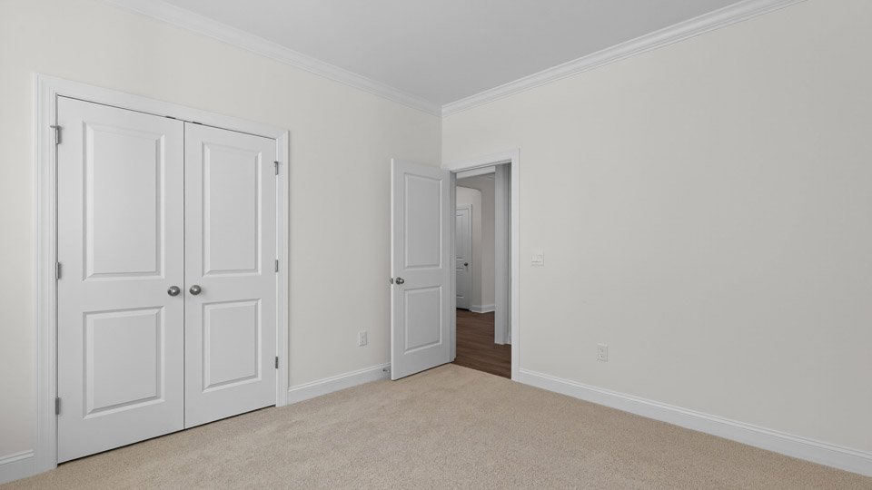 Bedroom with carpet floor and closet