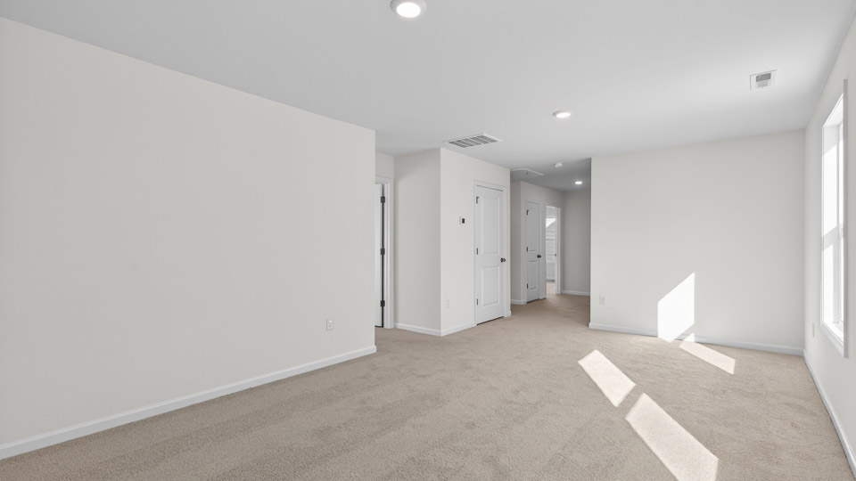 loft with carpet flooring