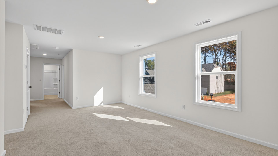loft with carpet flooring