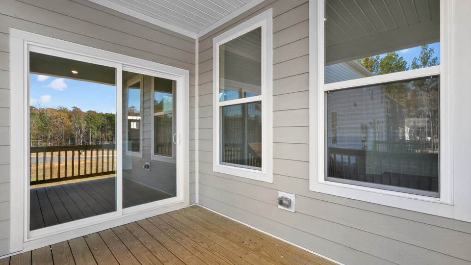 sliding glass doors leading into home from back patio