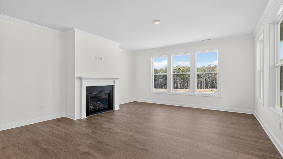 living room with revwood flooring and fireplace