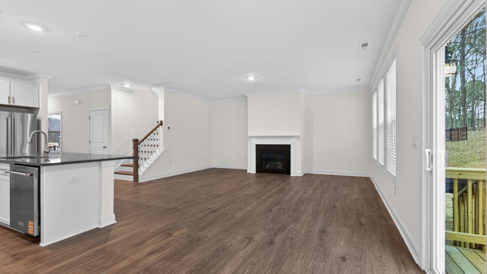 living room with revwood flooring and fireplace