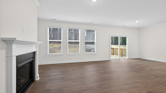living room with revwood flooring and fireplace