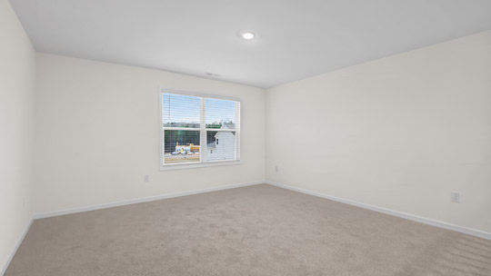 loft with carpet flooring