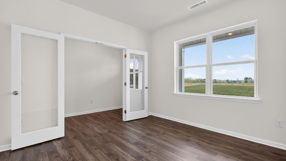 Study room with hardwood floors and big windows