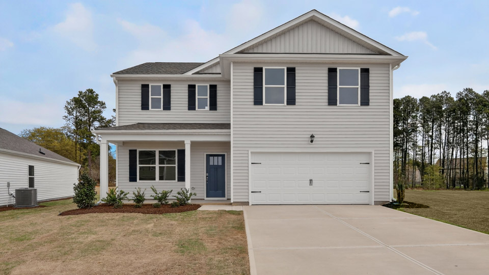 Two story home with white colored siding with a two car garage