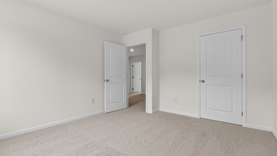 Bedroom with carpet floor and closet