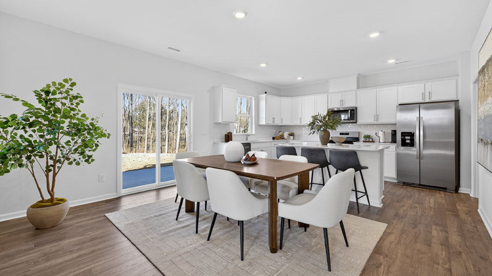 open concept dining space with sliding glass door to patio