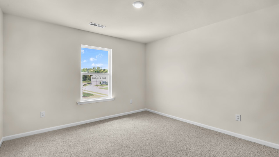 additional bedroom with window, carpeting, closet