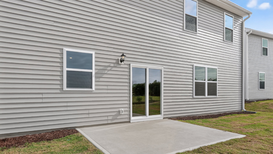 concrete patio with sliding glass doors