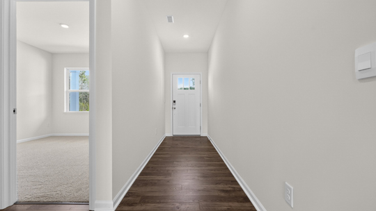 foyer entryway with revwood flooring
