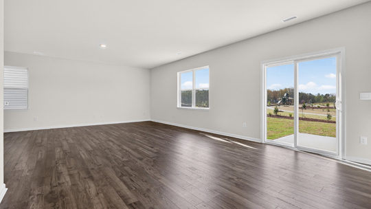 living room with revwood flooring and sliding glass doors