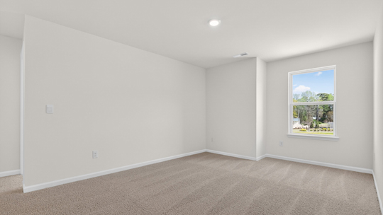 loft with carpet flooring