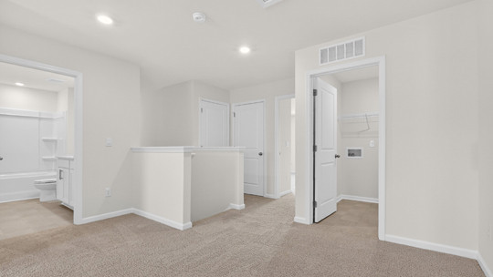 loft with carpet flooring