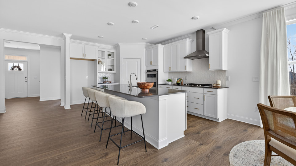 Kitchen with white cabinets and stainless steel appliances.