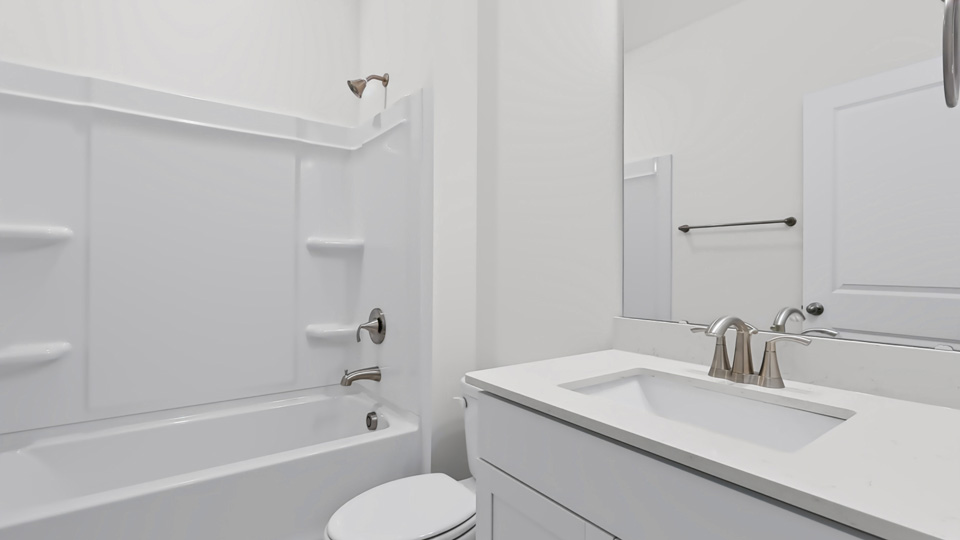secondary bathroom with tub shower combo