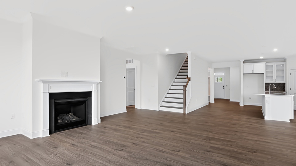 living room with revwood flooring and fireplace