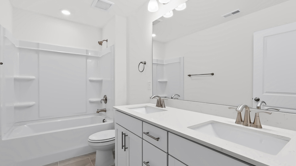 secondary bathroom with tub shower combo