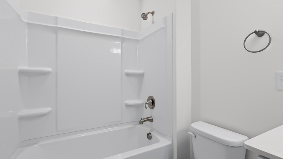 secondary bathroom with tub shower combo